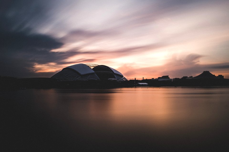 concrete building near body of water