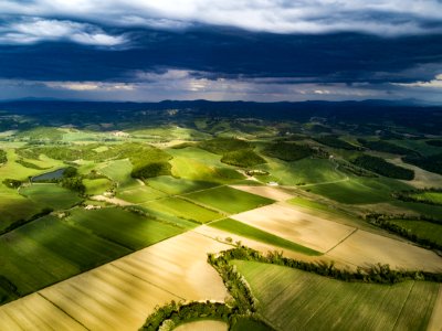 green grass field under white clouds photo