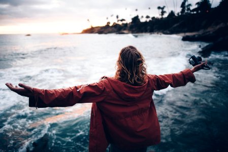 person standing near body of water photo