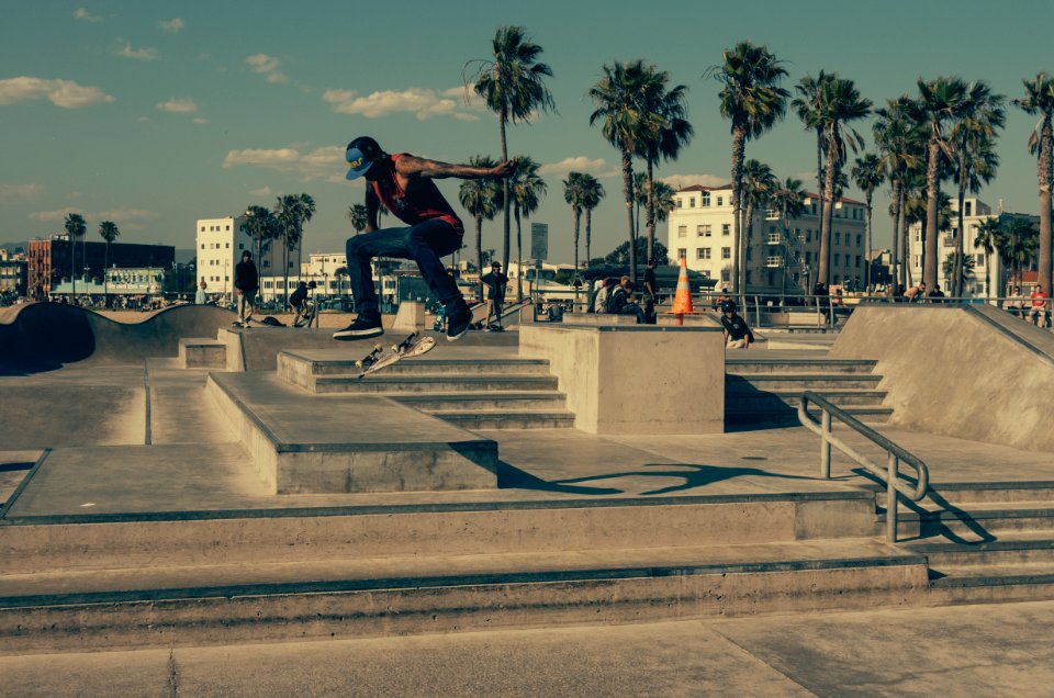 time lapse photography of man skateboarding outside