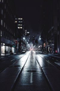 empty road in city during night photo