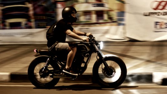 man riding on motorcycle photo