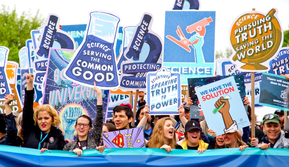group of people with signages