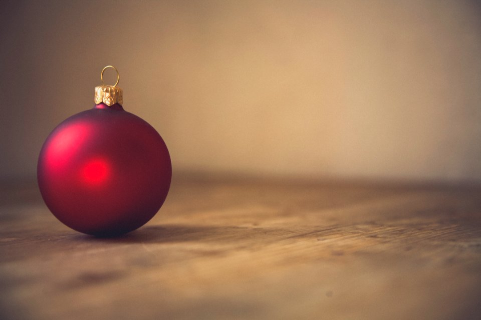 closeup photo of red ball ornament on surface photo