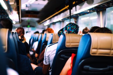 selective focus photography of people on bus photo