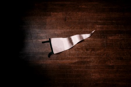 white pennant on brown surface