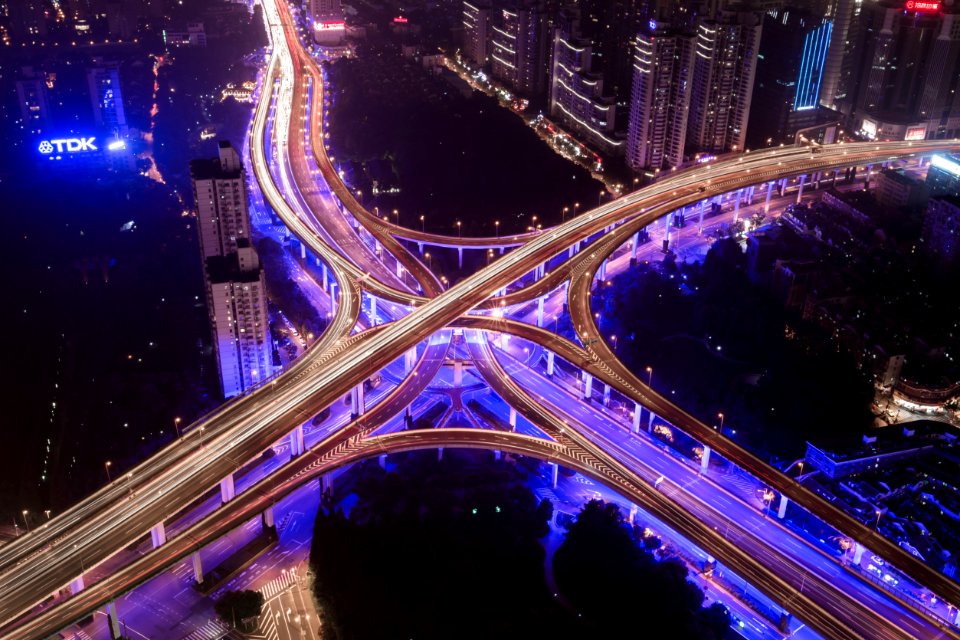 aerial photography of bridge near buildings