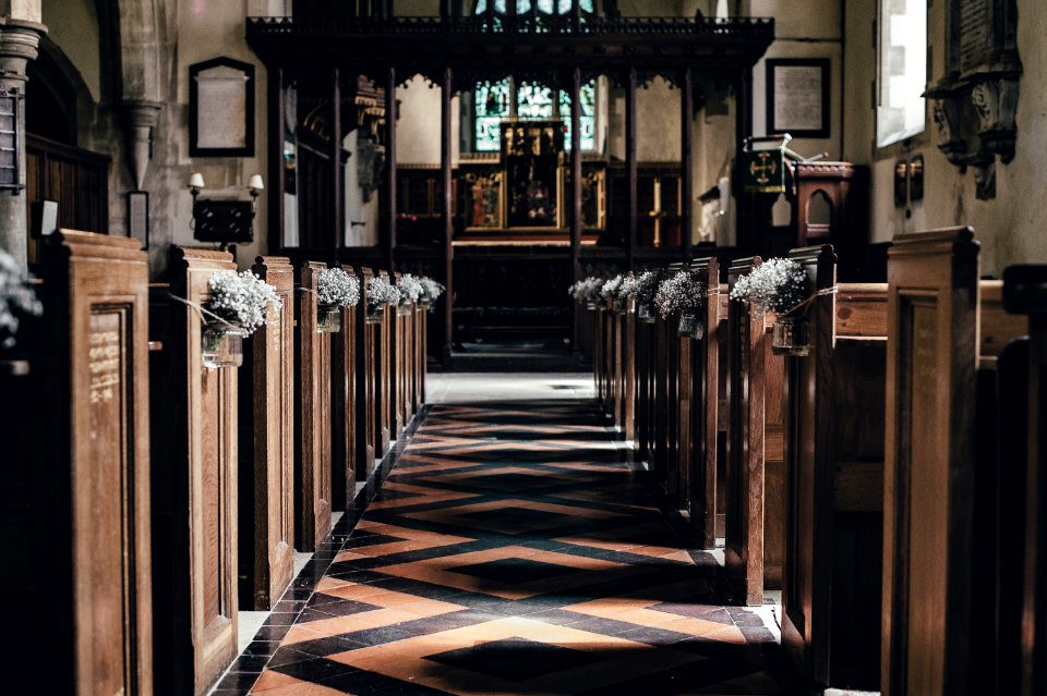wooden pew near altar