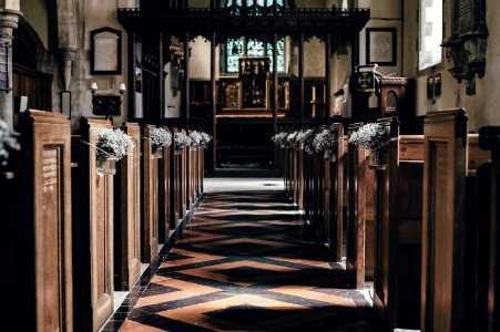 wooden pew near altar photo