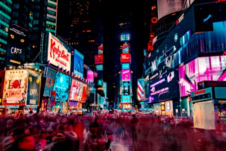 time-lapse photography of crowd of people on New York Time square during night time photo