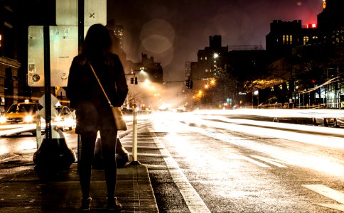 timelapse photography of woman standing near road photo
