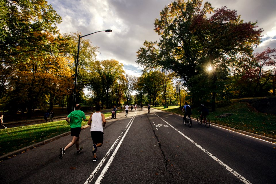 people running and riding bicycle