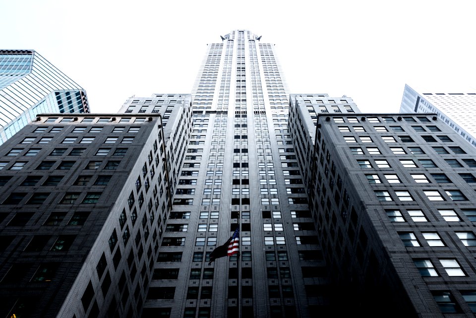 low angle photo of gray concrete high-rise building photo