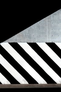 white and black diagonal striped paint on wall photo