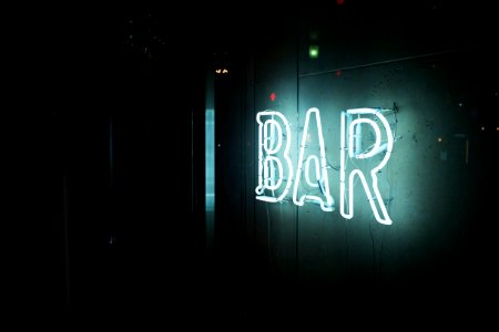 photo of turn-on white bar neon sign photo