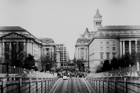 grayscale photo of people in city photo