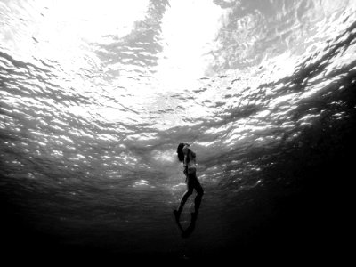 woman diving underwater photo
