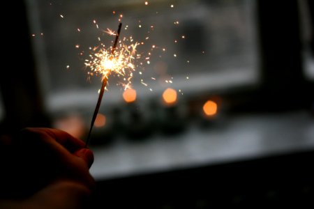 person holding sparkler photo