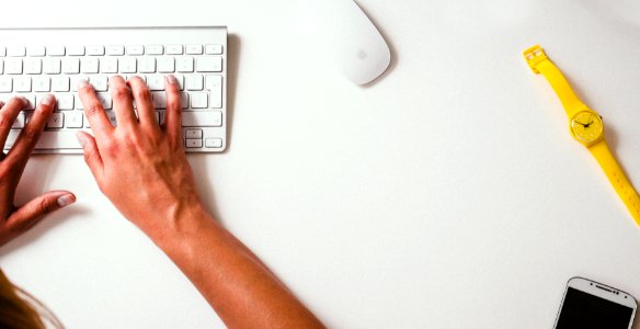 person typing on Apple Cordless Keyboard photo