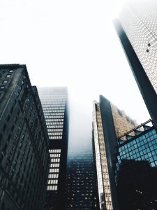 high-rise buildings covered with fog photo