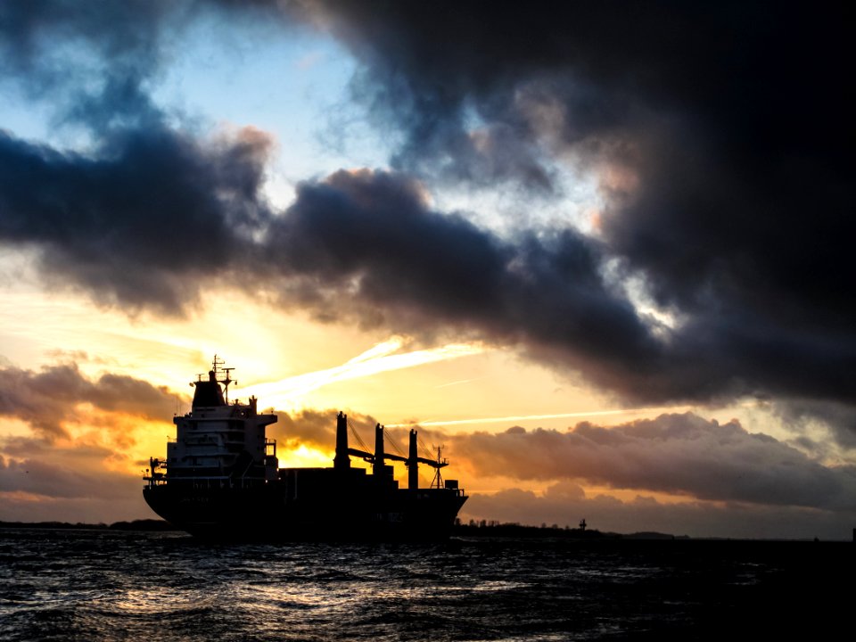 ship sailing during sunset