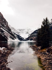 landscape photography of mountains and body of water photo