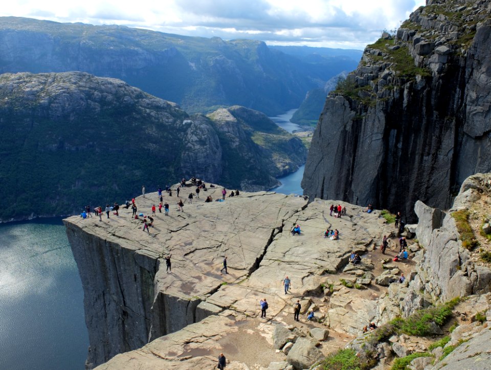 group of people on mountain cliff photo