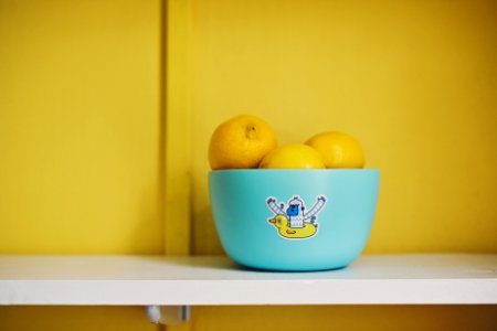 lemon fruits on teal bowl photo