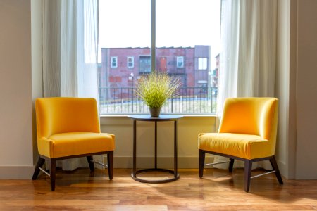 two yellow padded chairs