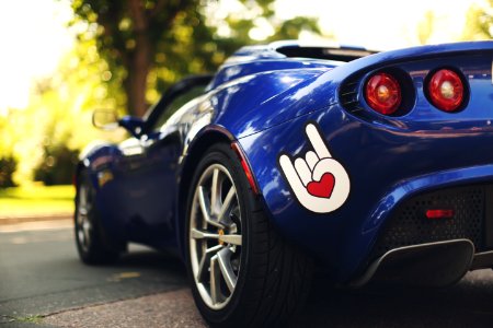 blue car parked on road photo