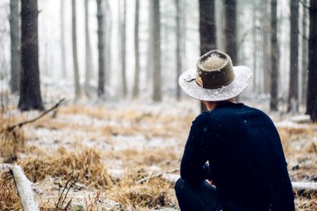 person sitting in grass field photo