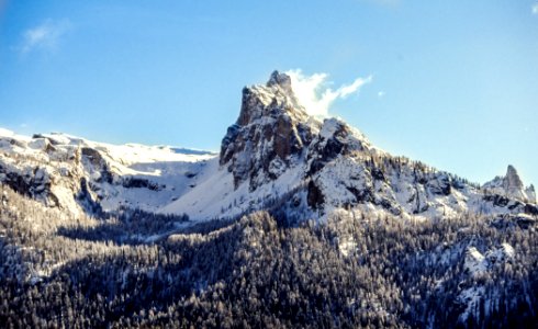 snow covered mountain under blue sky photo