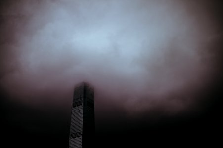 high-rise building under gray sky photo