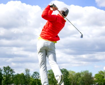 man in red long-sleeved top golf photo