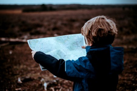 child looking at map photo