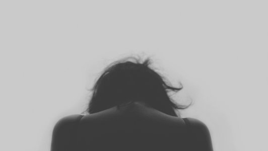 grayscale photo of person's back photo