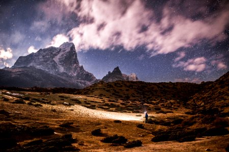 person on land near on mountain photo