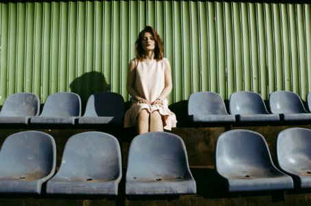 woman sitting on gang chair photo