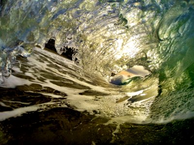 A small wave coming to the shore.