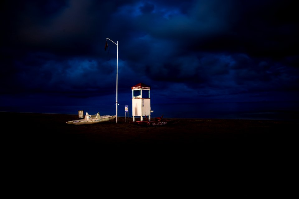 white shed under black sky