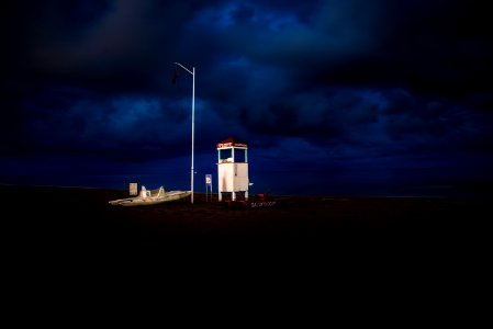 white shed under black sky