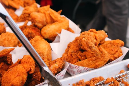fried chicken on brown paper bag photo