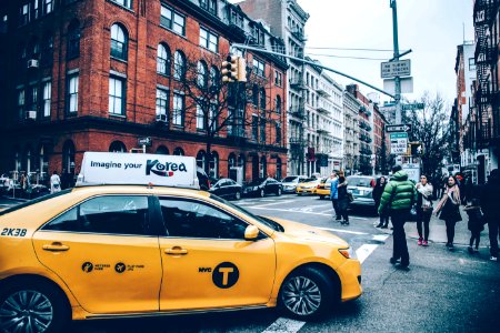 yellow cab in city photo