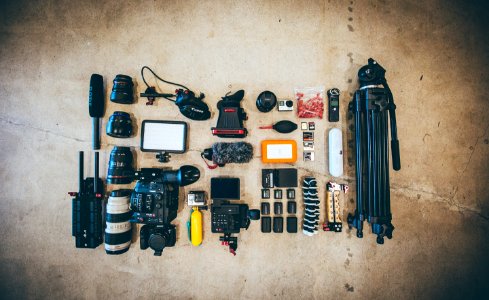 flat lay photo of camera gear on floor photo