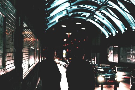 two people standing near road photo