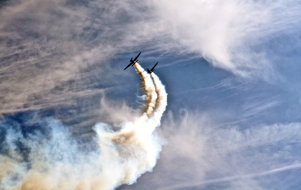 two planes with smoke trails