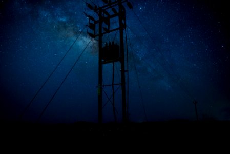 silhouette photography of post during starry night