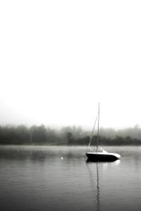 black and white boat on lake