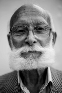 grayscale photo of man wearing eyeglasses photo