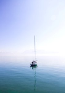 white boat on a body of water photo